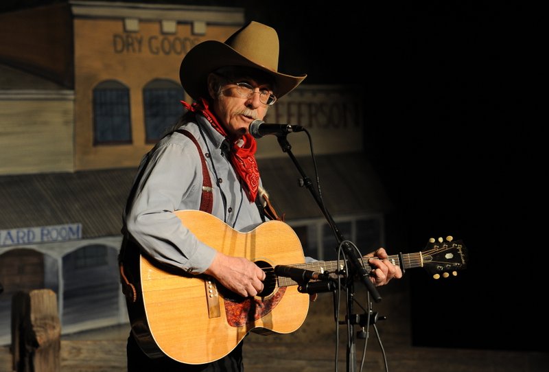 Bob Bovee playing his guitar